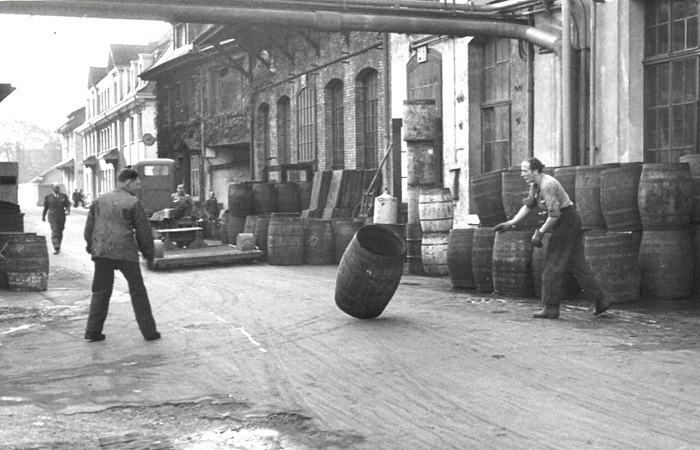 Hans Müller engaged in rolling the barrels.